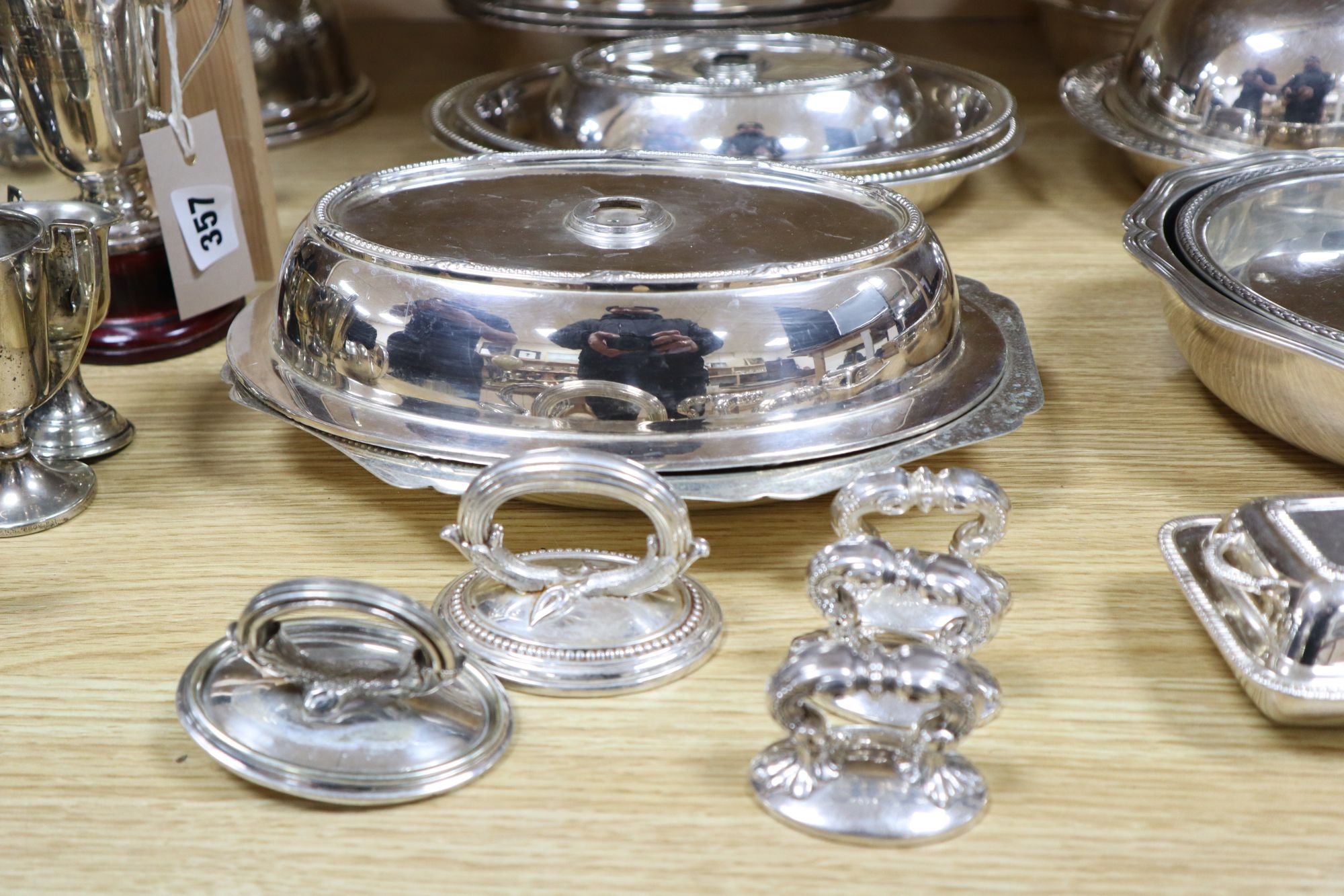 A quantity of plated items, including entree dishes and covers,